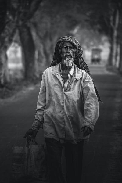 Behavioral Health Equity | curaJOY man walking while carrying bag